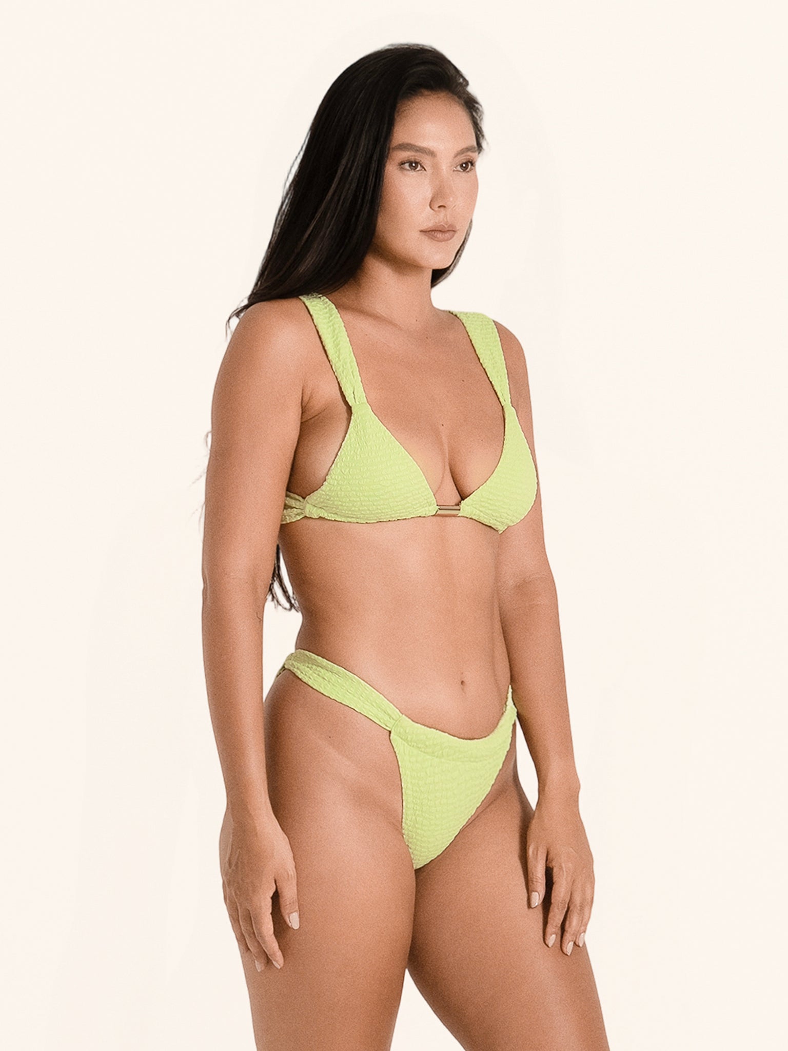 Modern lime green bikini bottom with sleek waistline and high-leg cut.