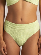 Front close-up of textured lime green bikini bottom with wide waistband.