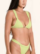 Supportive lime green bikini top with thick straps and flattering cut.