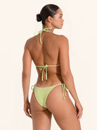 Lime green swimwear top in triangle style with tie straps.