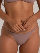 Close-up of mauve bikini bottom showing subtle texture and flattering cut