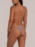 Angled back view of seamless mauve bikini bottom with cheeky fit
