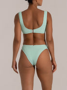 Back view of a mint green high-waisted bikini bottom with textured fabric