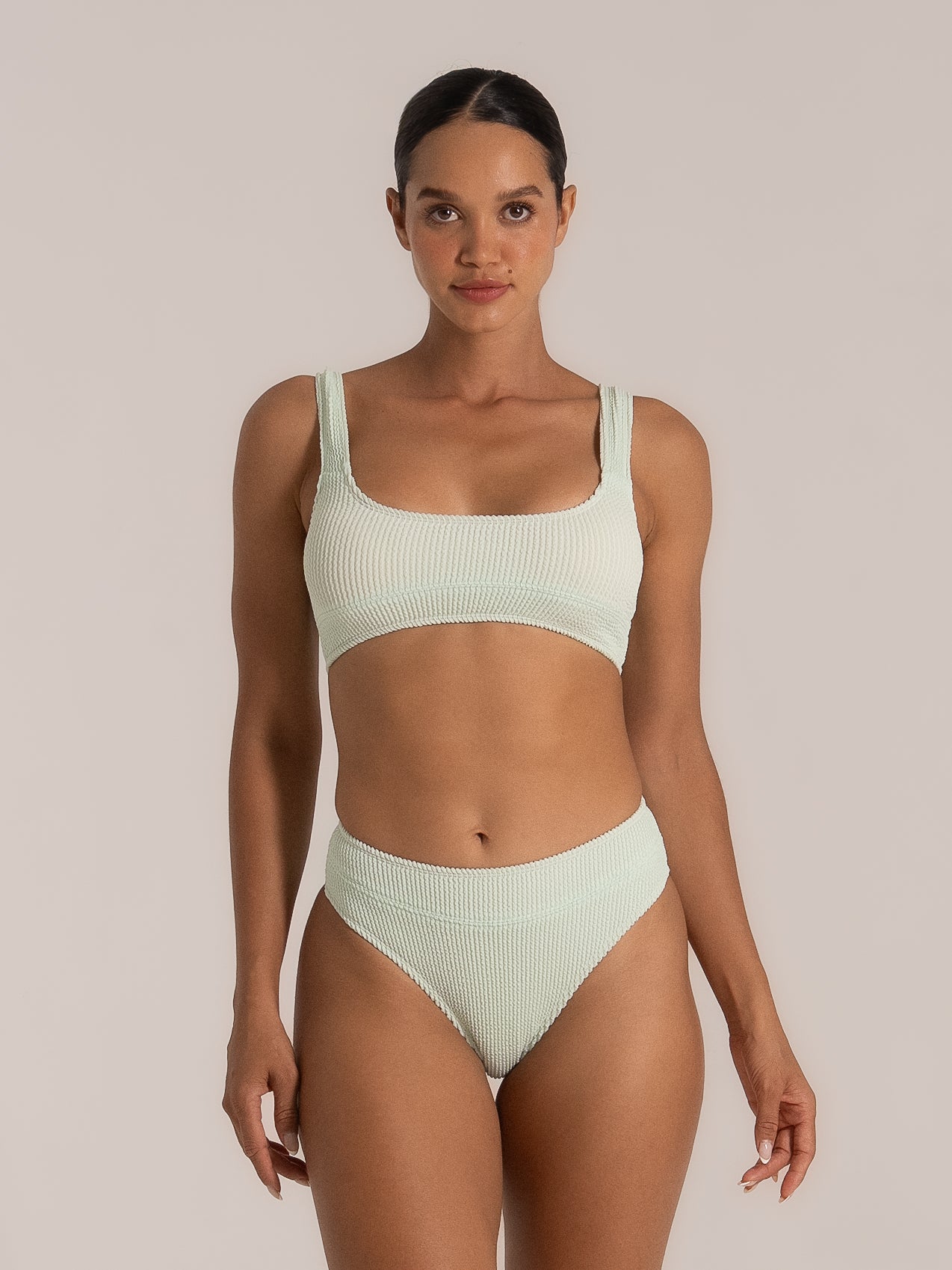 Front view of mint green bikini top with wide straps and high-waisted bottoms