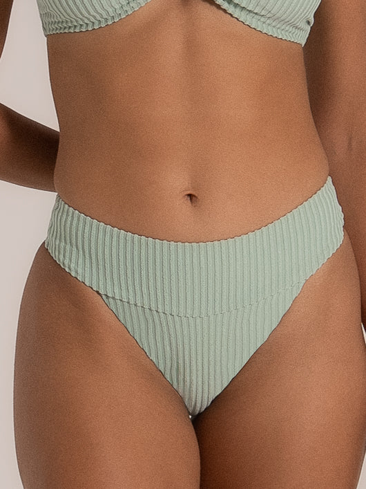 Close-up front detail of mint green high waisted ribbed bikini bottom