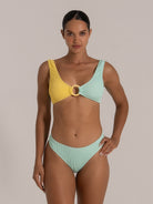 Full front view of a two-tone bikini top in mint green and yellow with a center ring