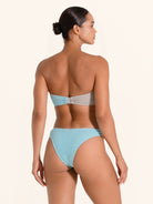Modern blue and grey bikini top with bandeau cut and stylish ring.