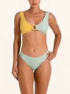 High leg bikini bottom in mustard yellow and mint green color block.