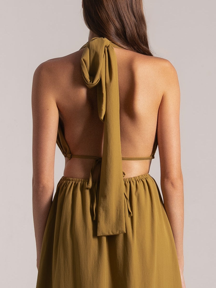 Back view of mustard yellow halter maxi dress