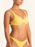 Side angle of mustard yellow bikini top showing supportive fit and sculpted bust.