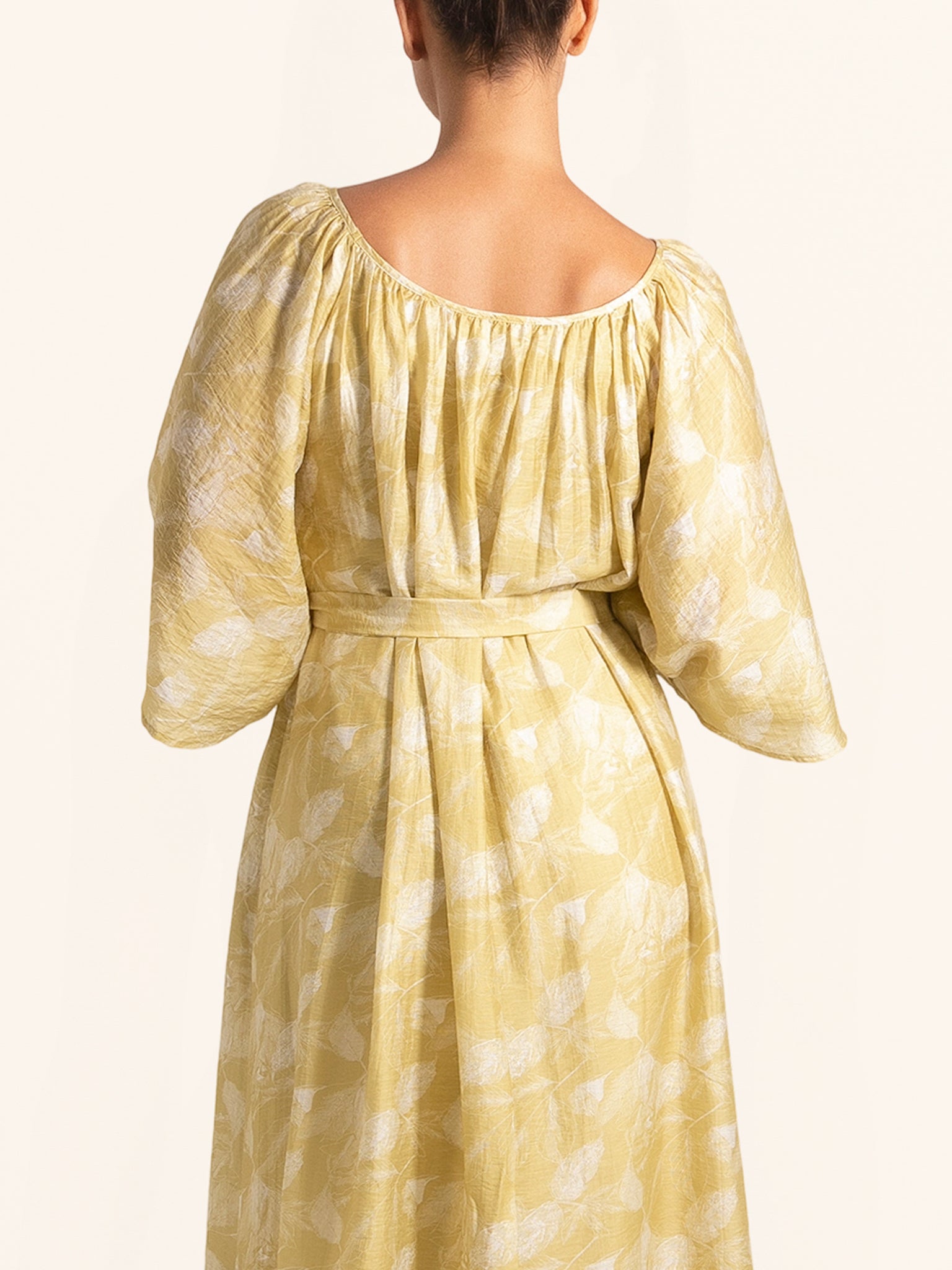 Back view of mustard yellow floral maxi dress with loose fit