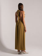 Side back view of mustard yellow halter maxi dress