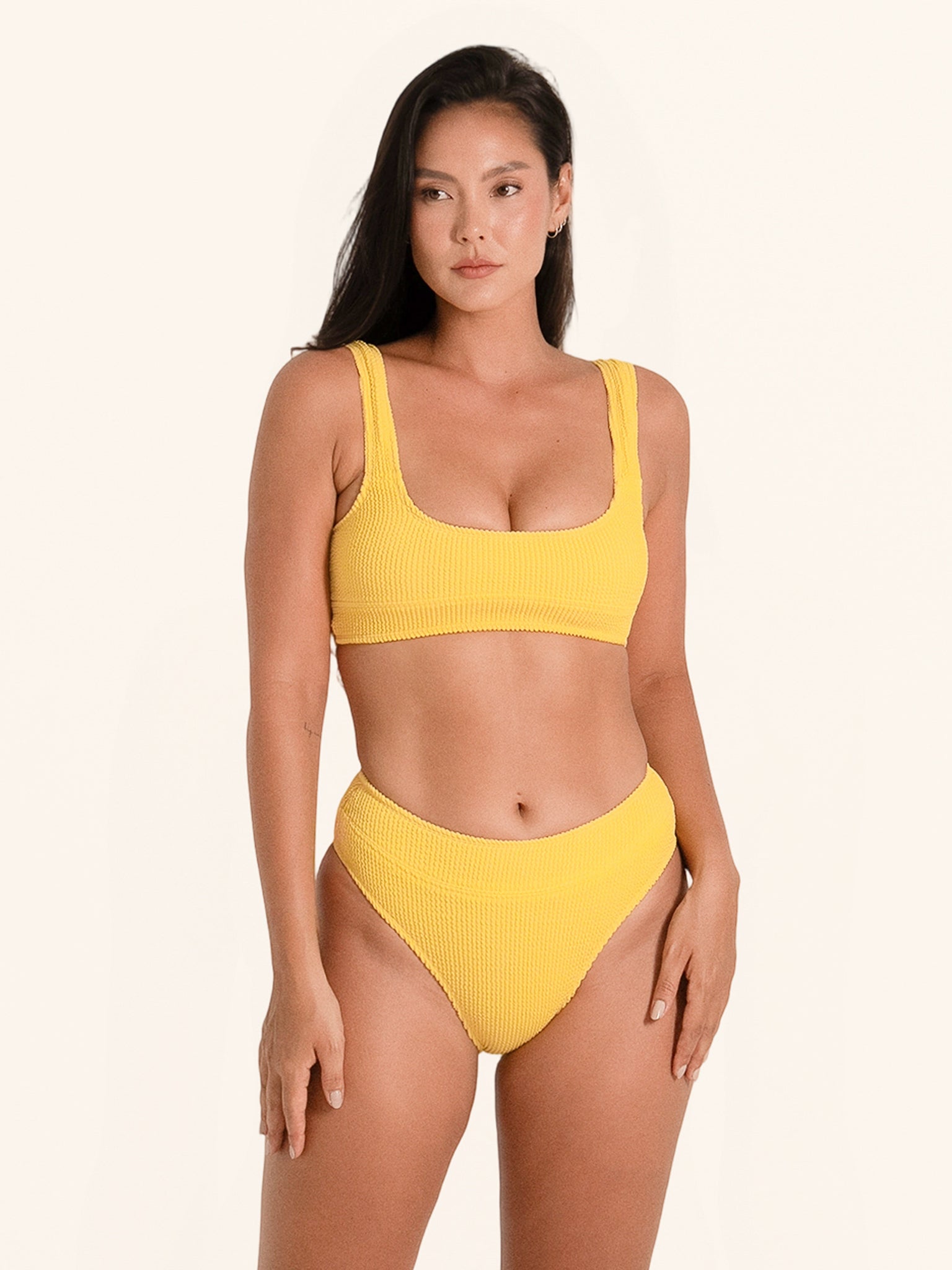 Textured swimwear top in mustard yellow with wide shoulder straps.