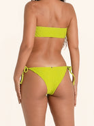 Neon green cheeky bikini bottom with playful side ties.