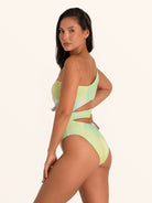 Angled view of Ocean Mystery asymmetric cut out swimsuit in green gradient
