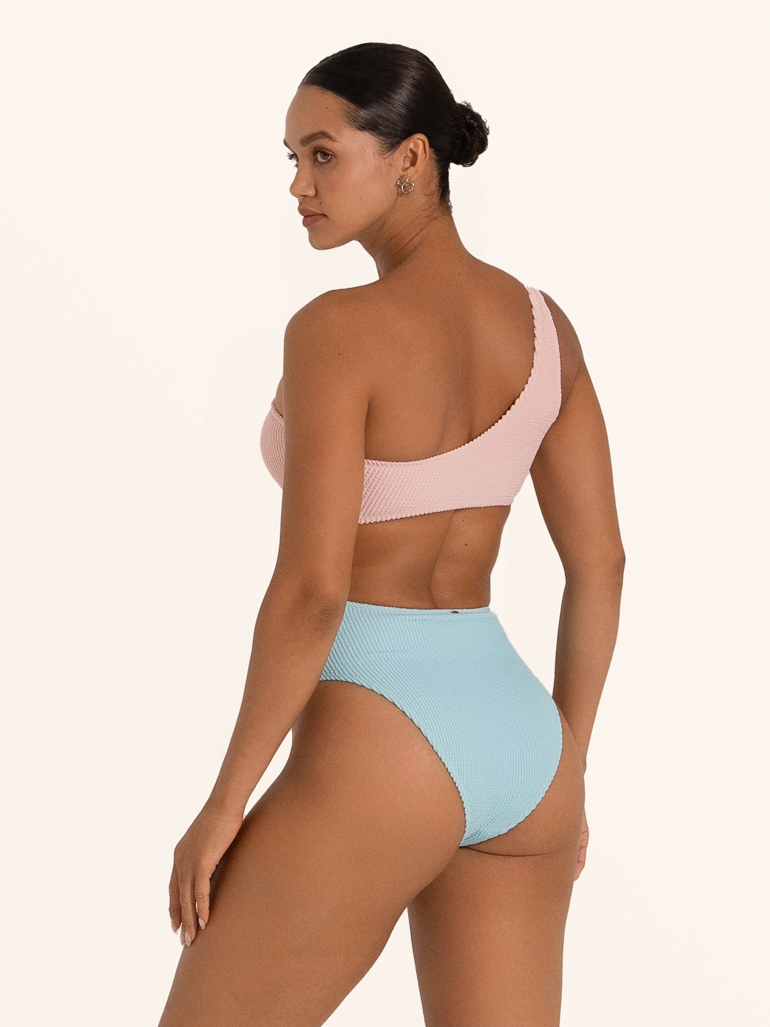 Back view of Ocean Mystery pink and blue one shoulder cut out one piece swimsuit