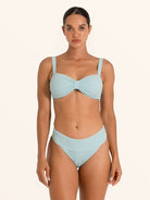 Back view of Ocean Mystery light blue textured bikini top with clasp closure.