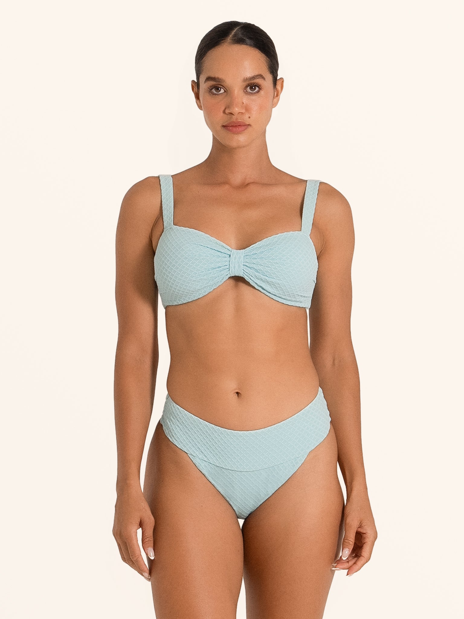 Back view of Ocean Mystery light blue textured bikini top with clasp closure.