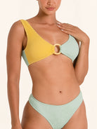 OCEAN MYSTERY bikini top in mustard and mint green with statement ring detail.
