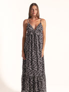 Full length view of Ocean Mystery black and white floral maxi dress featuring flowy silhouette.