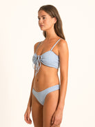 Ocean Mystery blue gingham bow tie bikini top designed with adjustable straps and chic front tie.