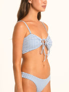 Side profile of Ocean Mystery blue gingham bow tie bikini top featuring front knot detail and flattering cut.