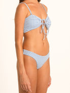 Back view of Ocean Mystery blue gingham hipster bikini bottom with cheeky coverage.
