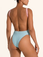 Back view of Ocean Mystery pink and blue cut out one piece swimsuit with scoop back design