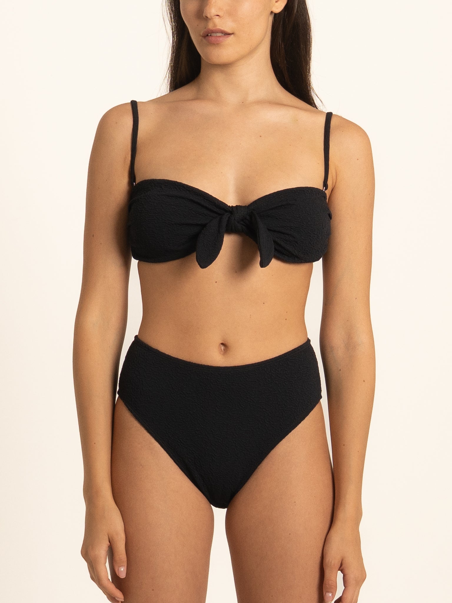 Front view of Ocean Mystery black high waist bikini bottom with sleek finish.