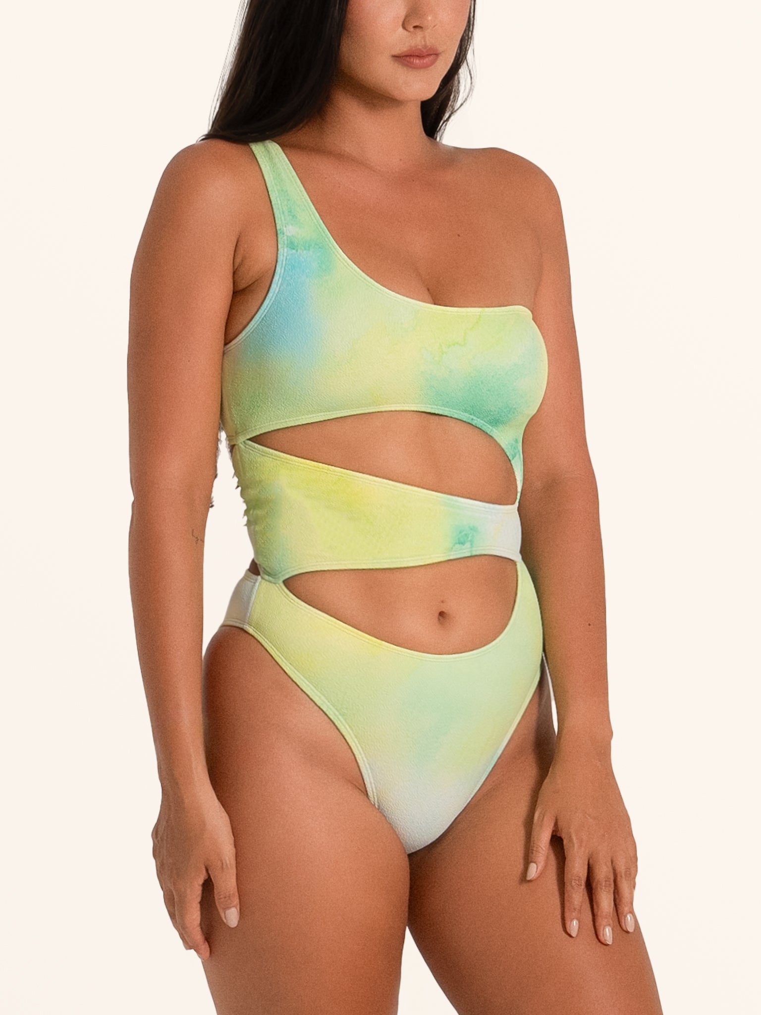 Side view of Ocean Mystery one piece swimsuit in green gradient with asymmetric cut out design