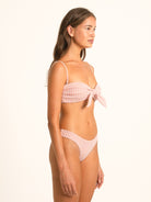 Model wearing Ocean Mystery red gingham hipster bikini bottom in mid-rise design.
