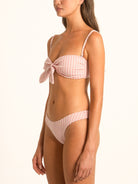 Side profile of Ocean Mystery red gingham sweetheart bikini top featuring bow front and soft stretch fit.