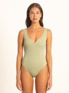 Ocean Mystery sage green modern fit one piece swimsuit with elegant neckline.