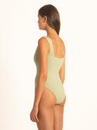 Side profile of Ocean Mystery sage green one piece swimsuit with sleek cut.