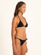 Side profile of Ocean Mystery black tie side bikini bottom with adjustable ties.