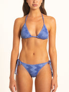 Side profile of Ocean Mystery blue textured bikini bottom with tie straps.