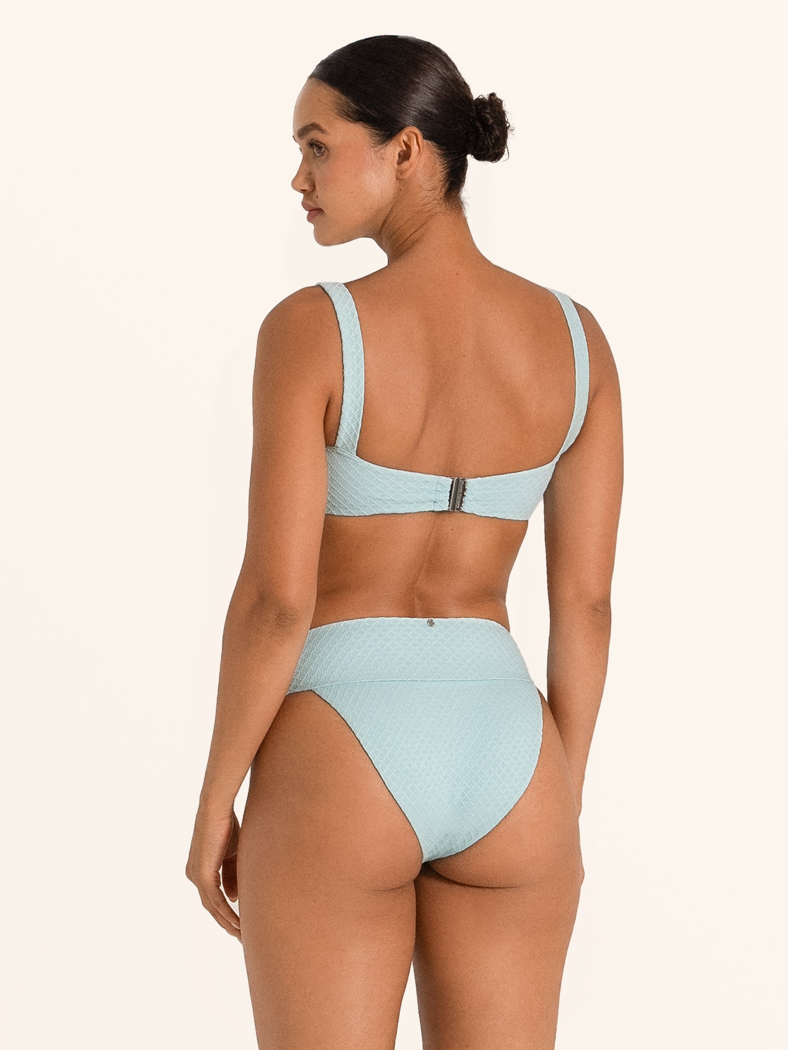 Ocean Mystery light blue bikini top with textured fabric and front knot detail.