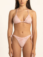Ocean Mystery pink textured bikini bottom with adjustable tie sides.