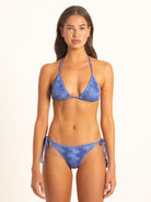 Side profile of Ocean Mystery blue textured bikini set featuring adjustable halter top and cheeky bottoms.