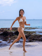 OCEAN MYSTERY classic white swimwear: textured triangle string bikini set with adjustable side-tie bottoms for beach vacations.