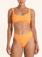 Orange bikini bottom offering full coverage with a sporty look.