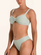 Pastel green ribbed bikini top with adjustable straps.