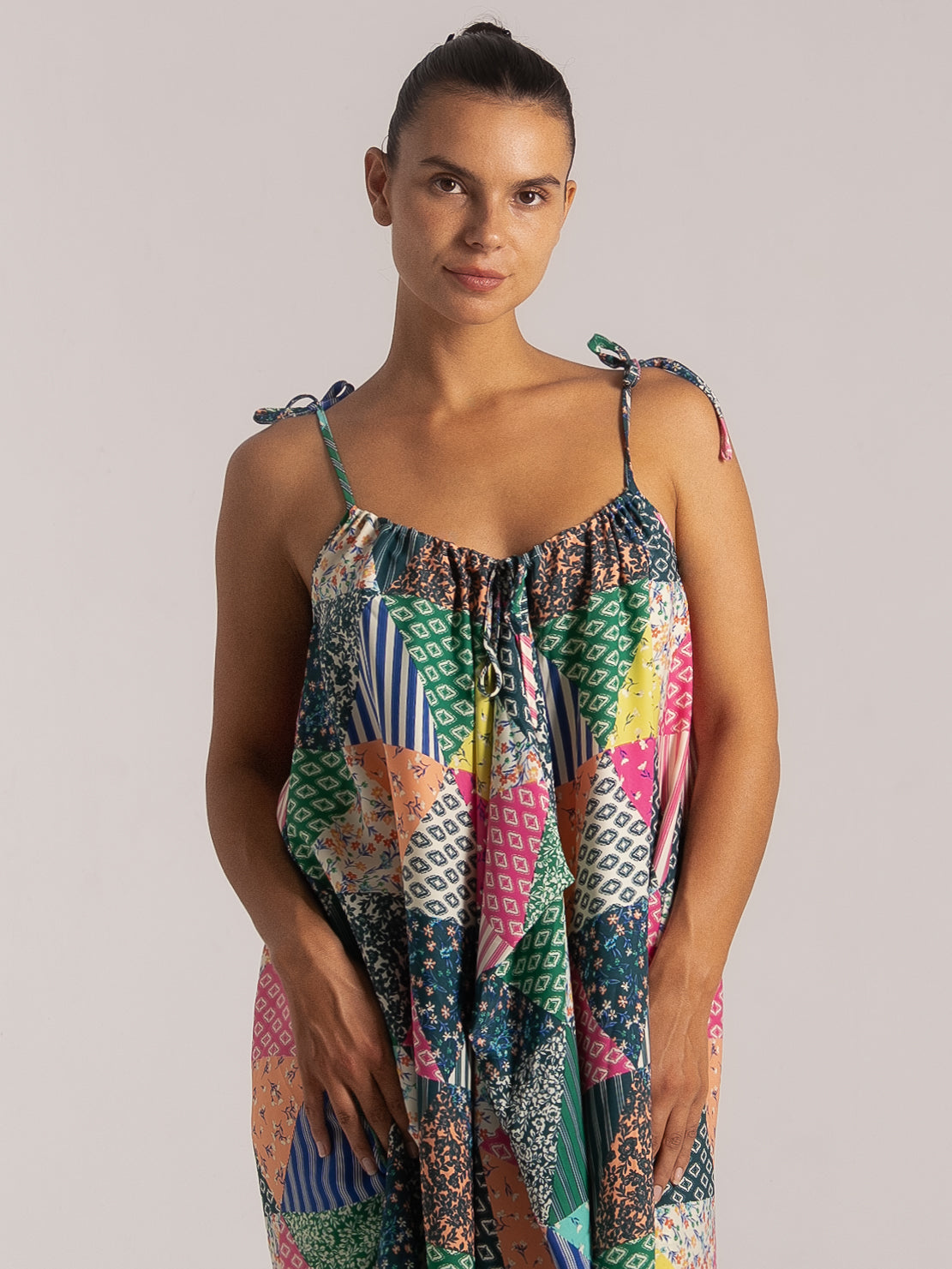 Colorful patchwork print dress with tie shoulder straps and flowy relaxed fit