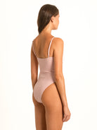 Back angled profile of the Peachy Pink Gingham One-Piece, demonstrating the contouring fit and quiet luxury resort aesthetic.