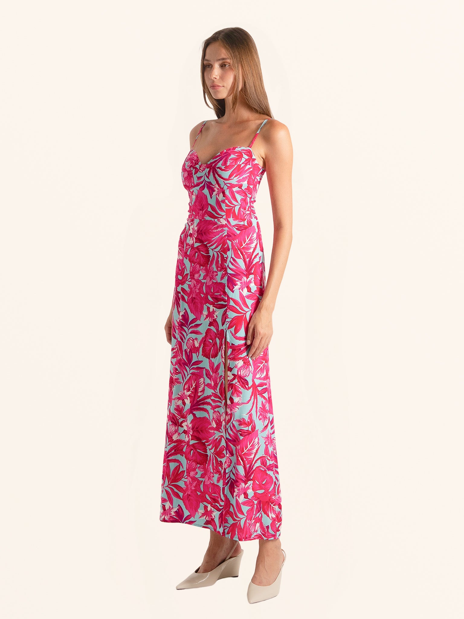 Side view of pink floral maxi dress with thigh high slit