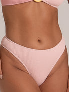 Front close-up of pink high waisted bikini bottom in waffle textured fabric
