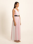 Side profile of pink maxi dress with V neckline and belted waist
