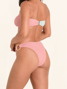 Pink and mint bikini bottom with playful summer vibe and flattering silhouette.
