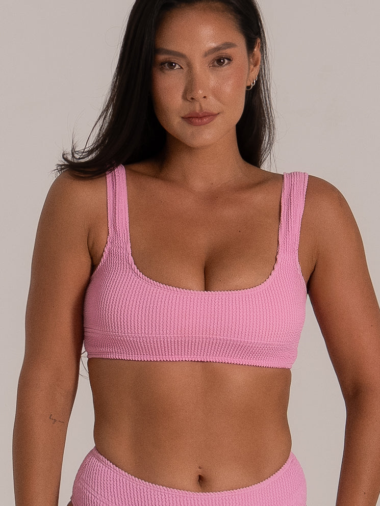 Close-up front view of pink square neckline bikini top with wide shoulder straps