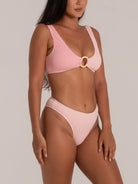 Pink textured high-waisted bikini bottom paired with matching ring detail bikini top